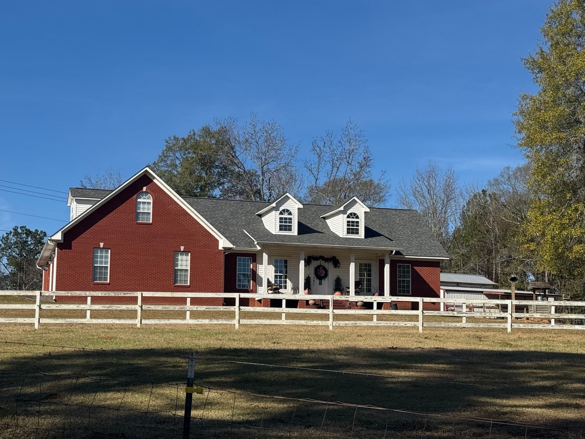 Expert Roof Installation on Charming Red Brick Home image